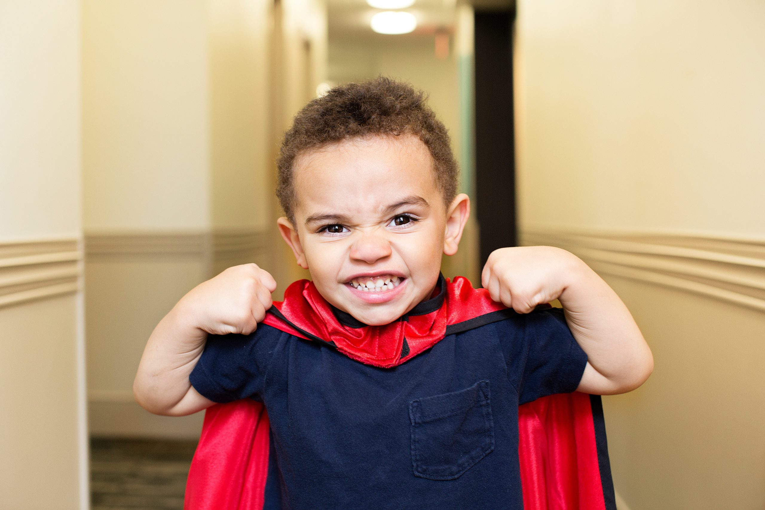 Young Boy in Red Cape