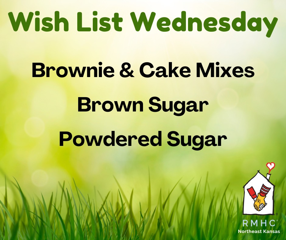 Graphic with a green, blurred outdoor background and grass along the bottom. Large title reads “Wish List Wednesday” in green, followed by a list in black text: “Brownie & Cake Mixes,” “Brown Sugar,” and “Powdered Sugar.” A Ronald McDonald House Charities (RMHC) Northeast Kansas logo appears in the bottom right corner.